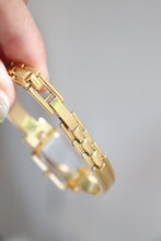 Load image into Gallery viewer, Vintage Givenchy 1990s Black Dial Gold Plated Bangle Watch
