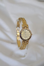 Load image into Gallery viewer, Rare Vintage Givenchy 1990s Gold Round Dial Bangle Watch with crystals
