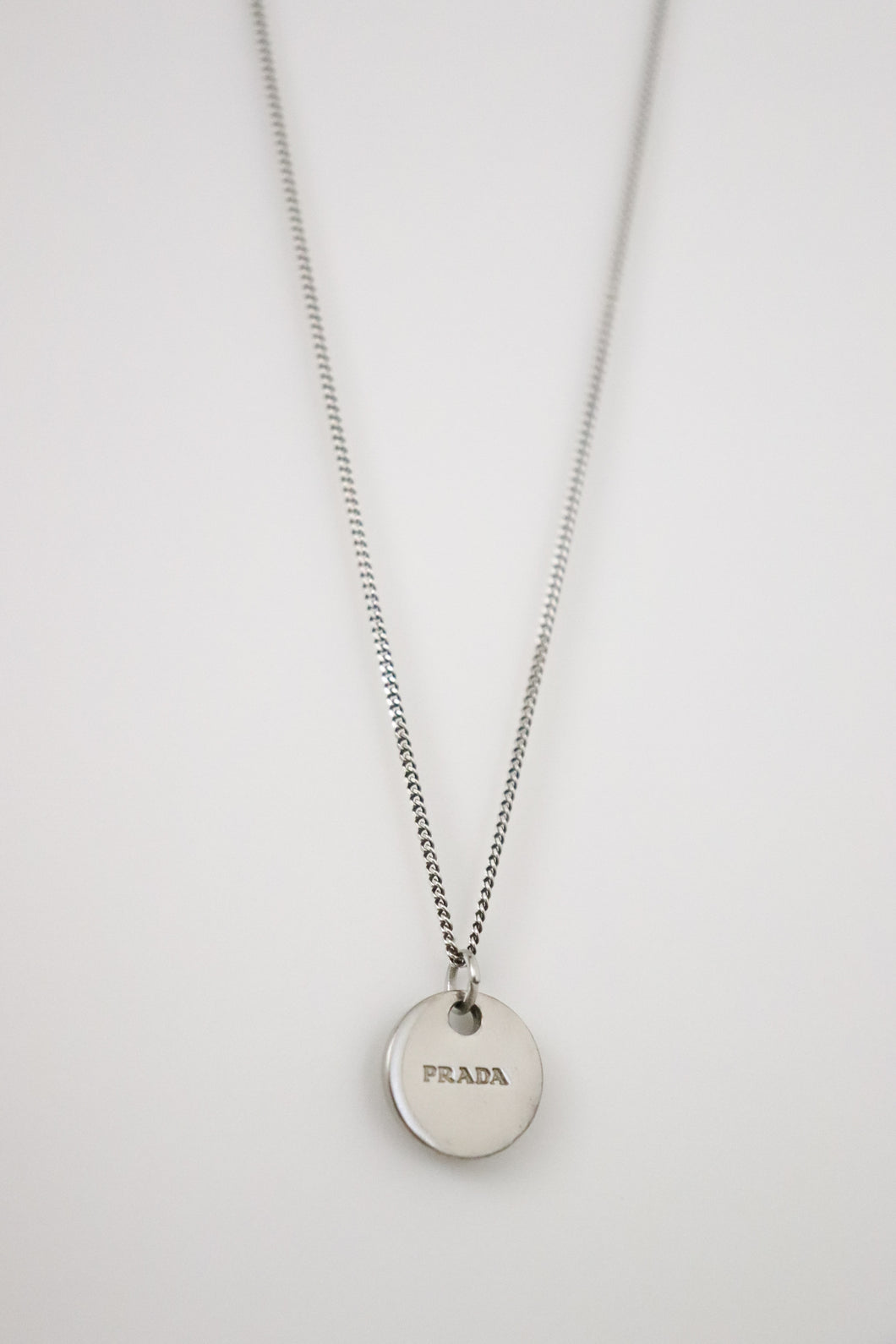 Prada round silver necklace