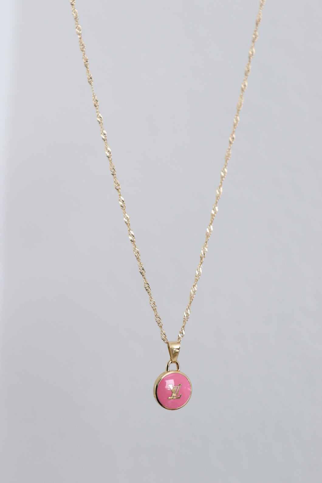Louis Vuitton logo in pink