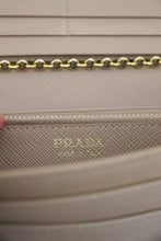 Lade das Bild in den Galerie-Viewer, Prada Saffiano metal bar continental flap wallet
